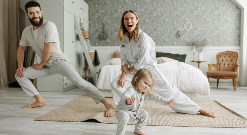 Parents exercising with their baby