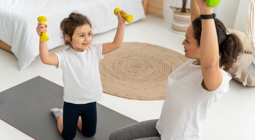 Woman getting kids involved in workout 